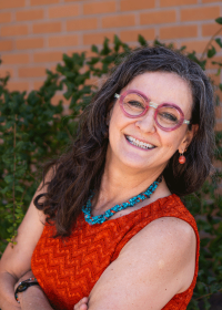 Professor Cheryl Conrad smiles at the camera.