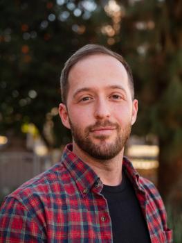 Michael Barlev looks toward the camera